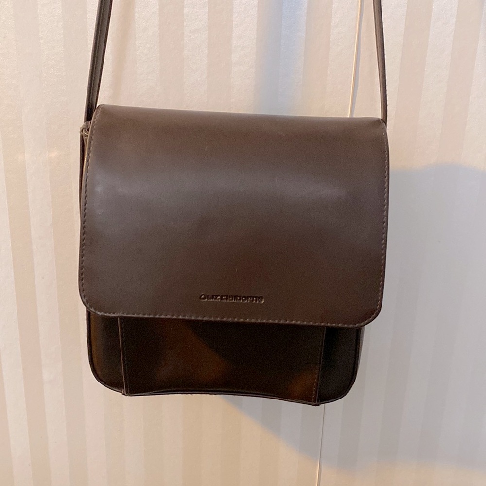 Liz Claiborne crossbody bag.   Measures 7.5” x 7.5”.   42” strap